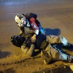 motorcyclist lying on road after accident