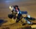 motorcyclist lying on road after accident
